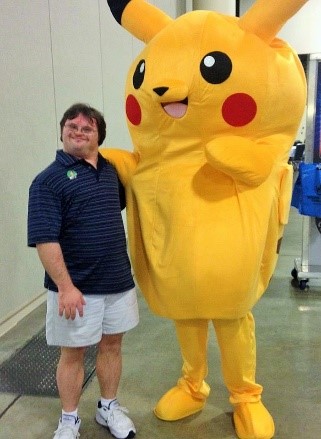 Karl Hunt with a large yellow pokemon