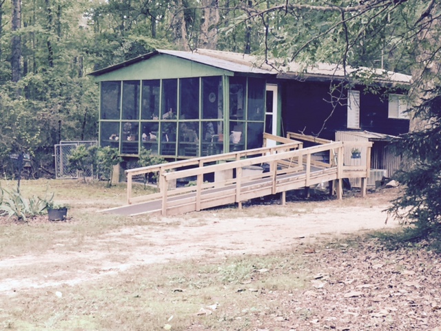 house in the country with long wheelchair ramp