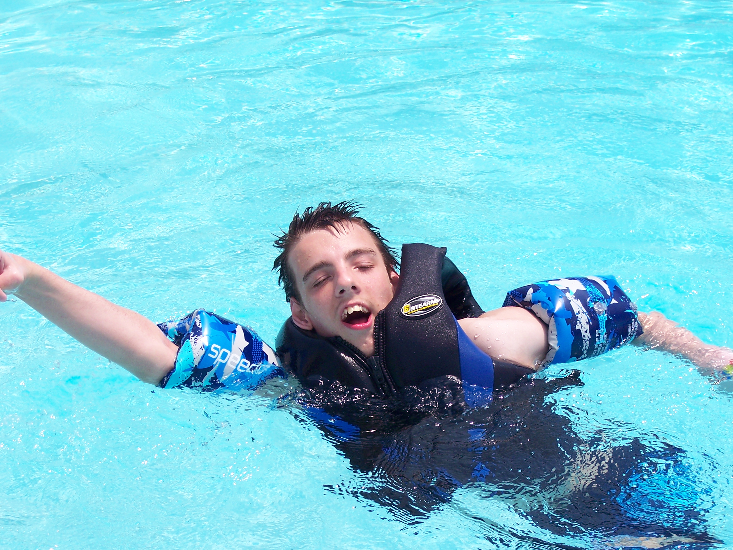 Nick swimming in a pool