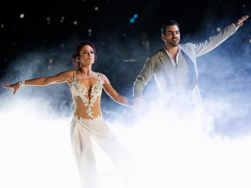 An action shot of a man and a woman dancing