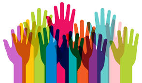 Many hands of all different colors are outstretched and overlapping
