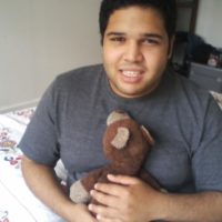 Arnaldo Rios Soto holding a teddy bear