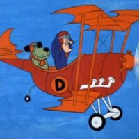 Cartoon picture of mutley the dog and dick dastardly in their orange bi-plane