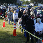 People waiting on a long line to get a vaccine