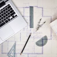 clip art of a laptop, drafting tools, and architectural plans