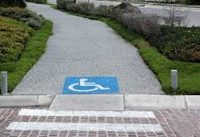 image of an accessible path with a wheelchair logo painted on the path