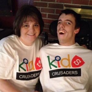 Julie and Nick wearing kids crusaders t-shirts