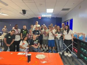 DIG Bowling Party with a group of Supper Social Participants having fun in the community